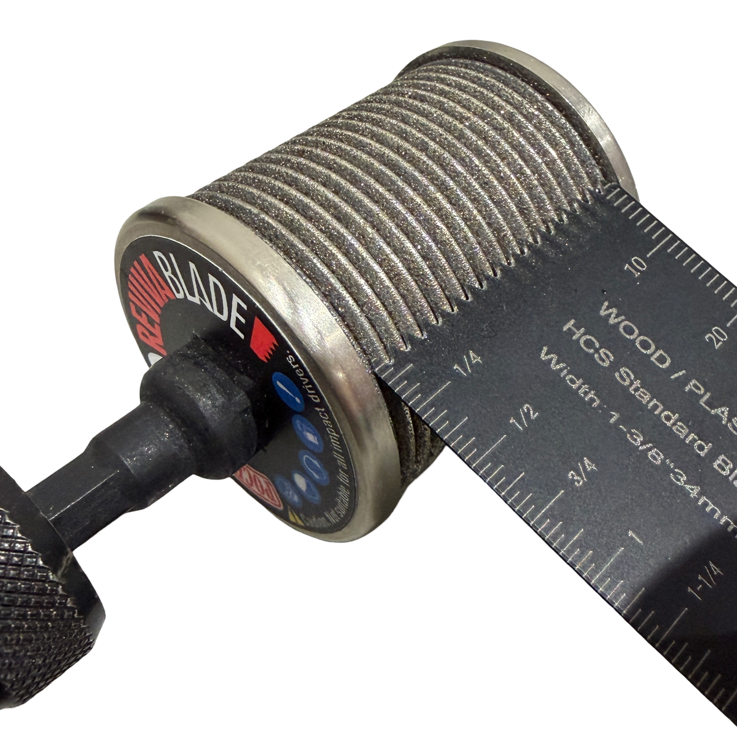 Close-up of the Revivablade Pocket Pro CBN sharpener fitted to a drill, showing a 34mm oscillating multi-tool blade spanning the full cutting width and the removable 3/8-inch arbor.
