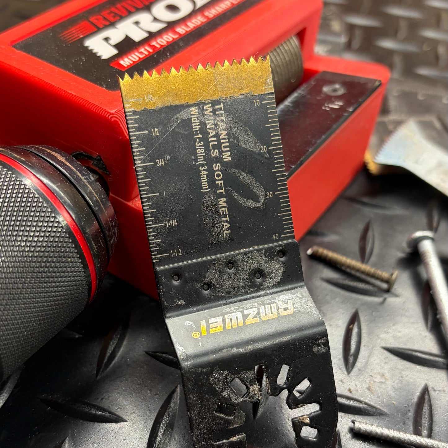 Revivablade Pro multi-tool blade sharpener on workshop bench