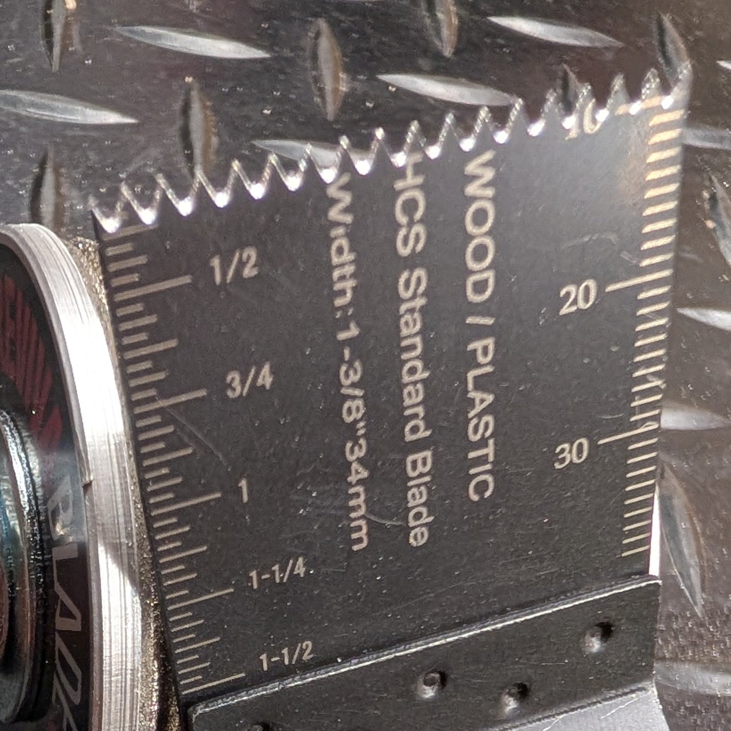 Detailed close-up of sharpened curved oscillating blade