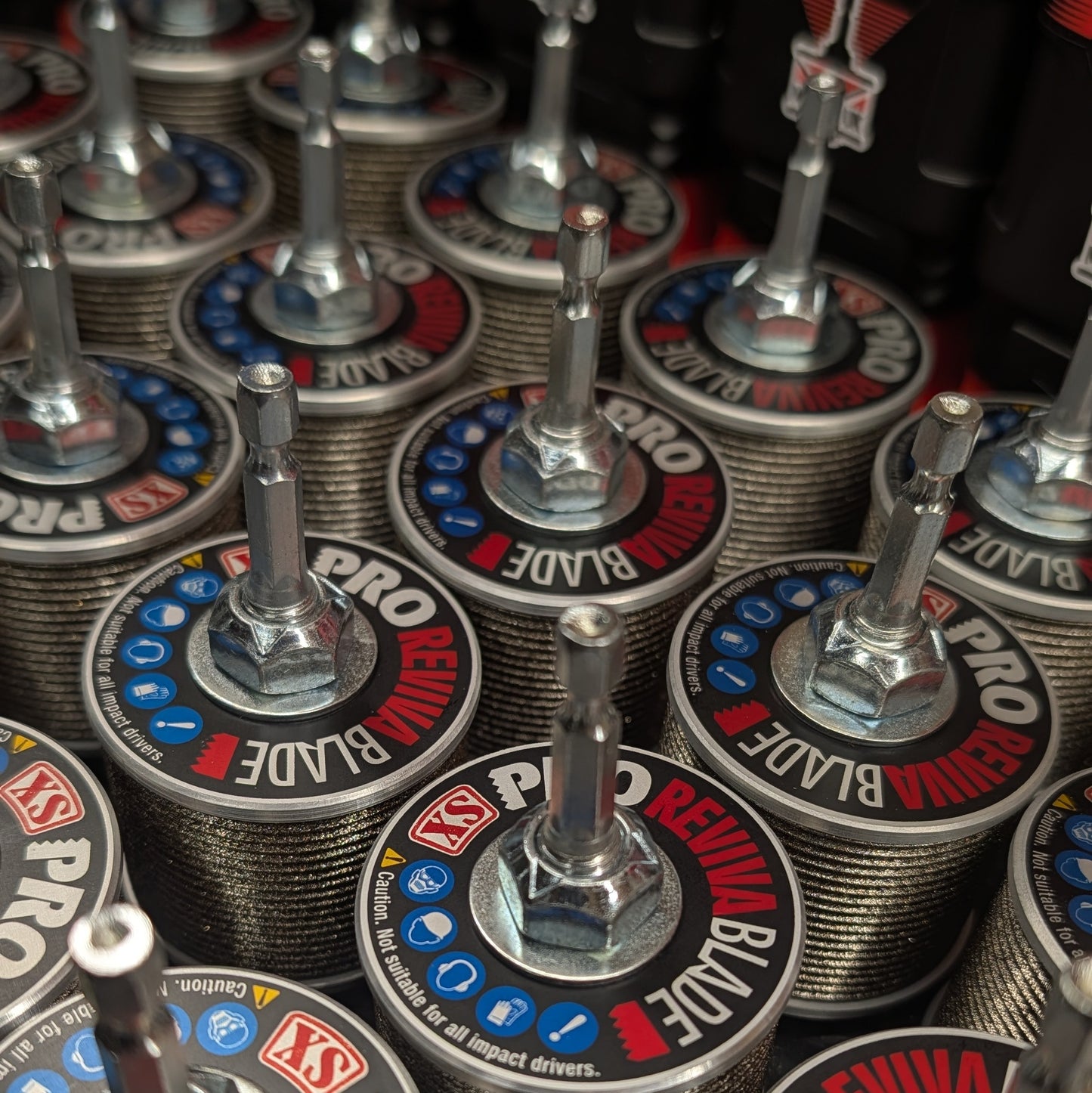 Close-up of multiple Revivablade XS Pro sharpeners with hex arbors